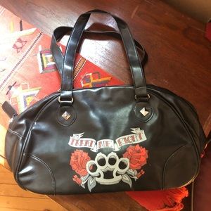 Black brass knuckles handbag